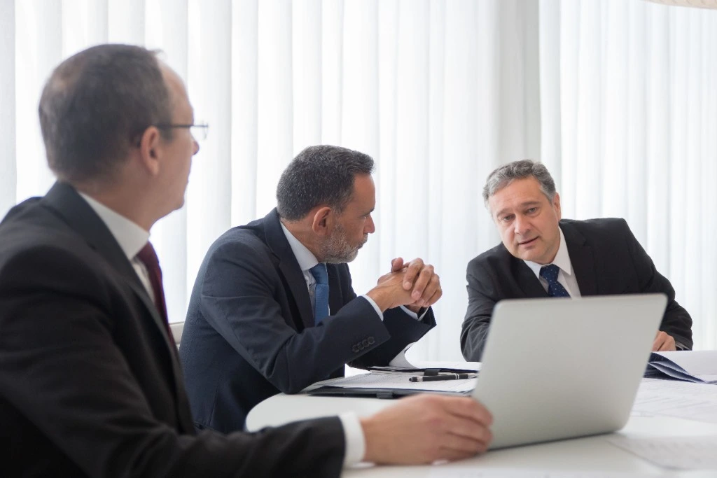 Northwest Solicitors solicitors in a client meeting reviewing case strategy and growth plans